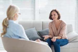 woman talks with therapist about tms therapy program in massachusetts
